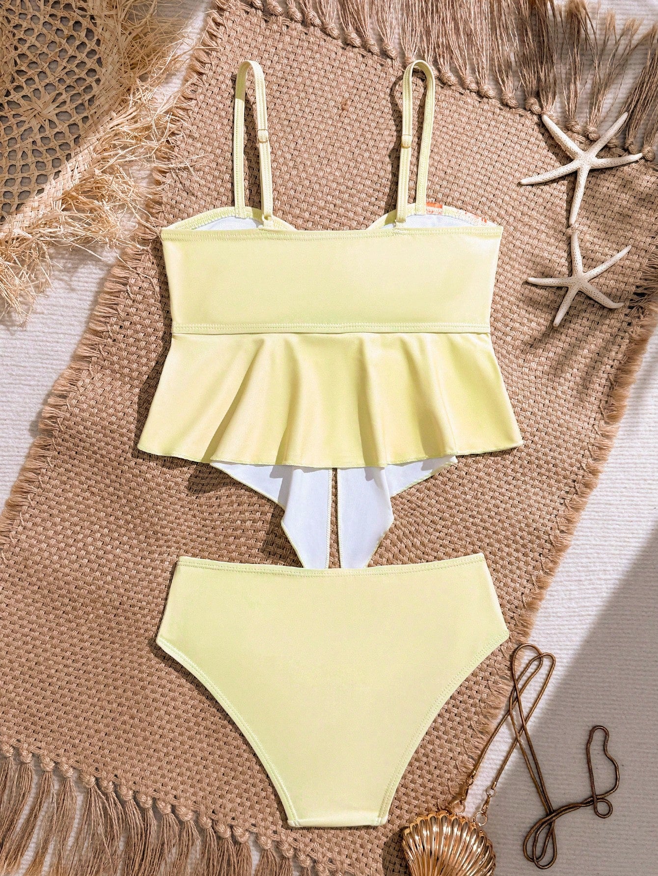 Tween girls 2-piece tankini swimwear set in apricot with a textured jacquard look, asymmetrical spaghetti-strap sleeveless top, and matching mid-waist short bikini bottoms.