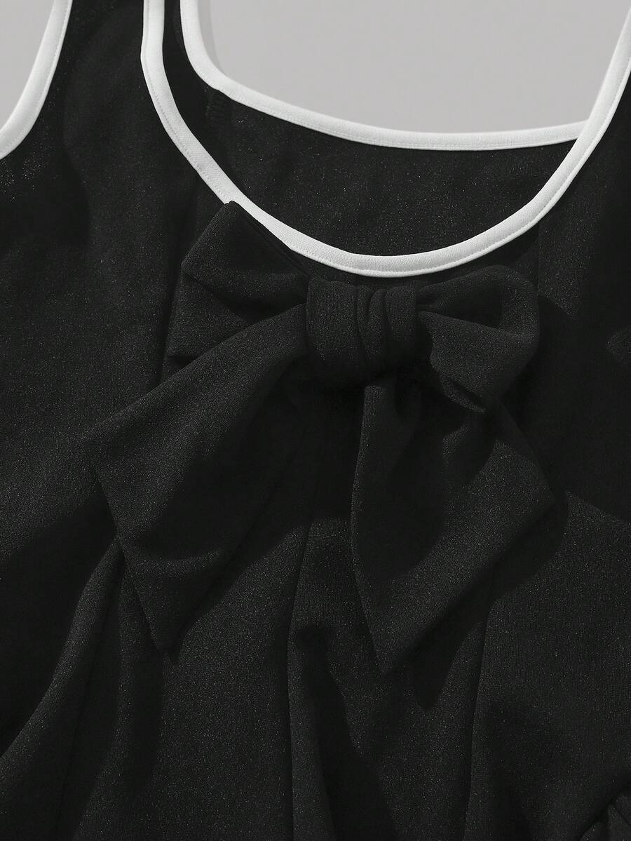 Apricot short-sleeve holiday party dress for tween girls featuring a square neckline, contrast lace details, high waist, flared A-line hem, and bowknot ruffle back detail.
