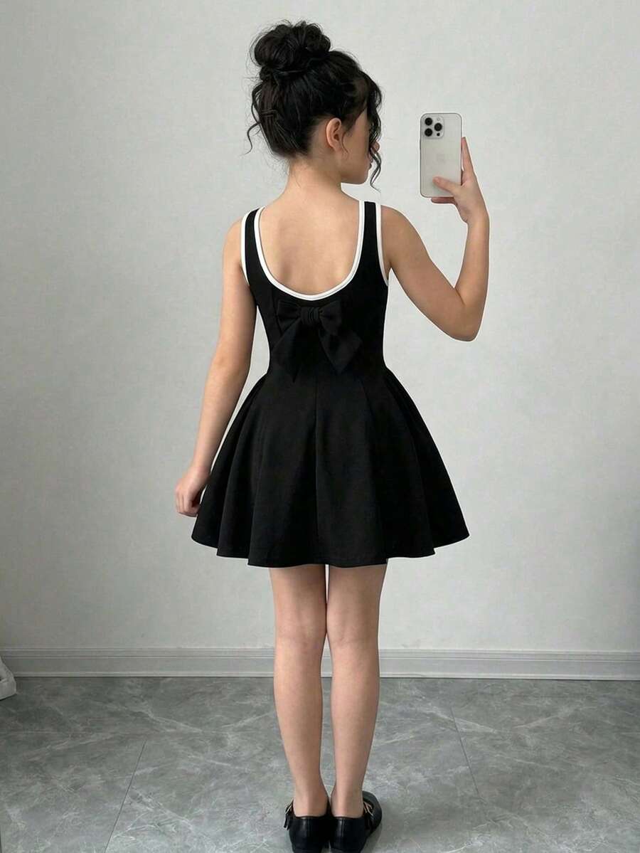 Apricot short-sleeve holiday party dress for tween girls featuring a square neckline, contrast lace details, high waist, flared A-line hem, and bowknot ruffle back detail.
