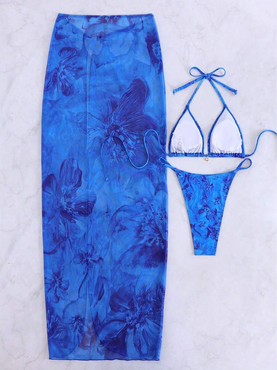 Women's 3-piece floral swimsuit set featuring a multicolor tie-back halter bikini top, low-waist bottoms, and a matching sheer mesh maxi skirt.