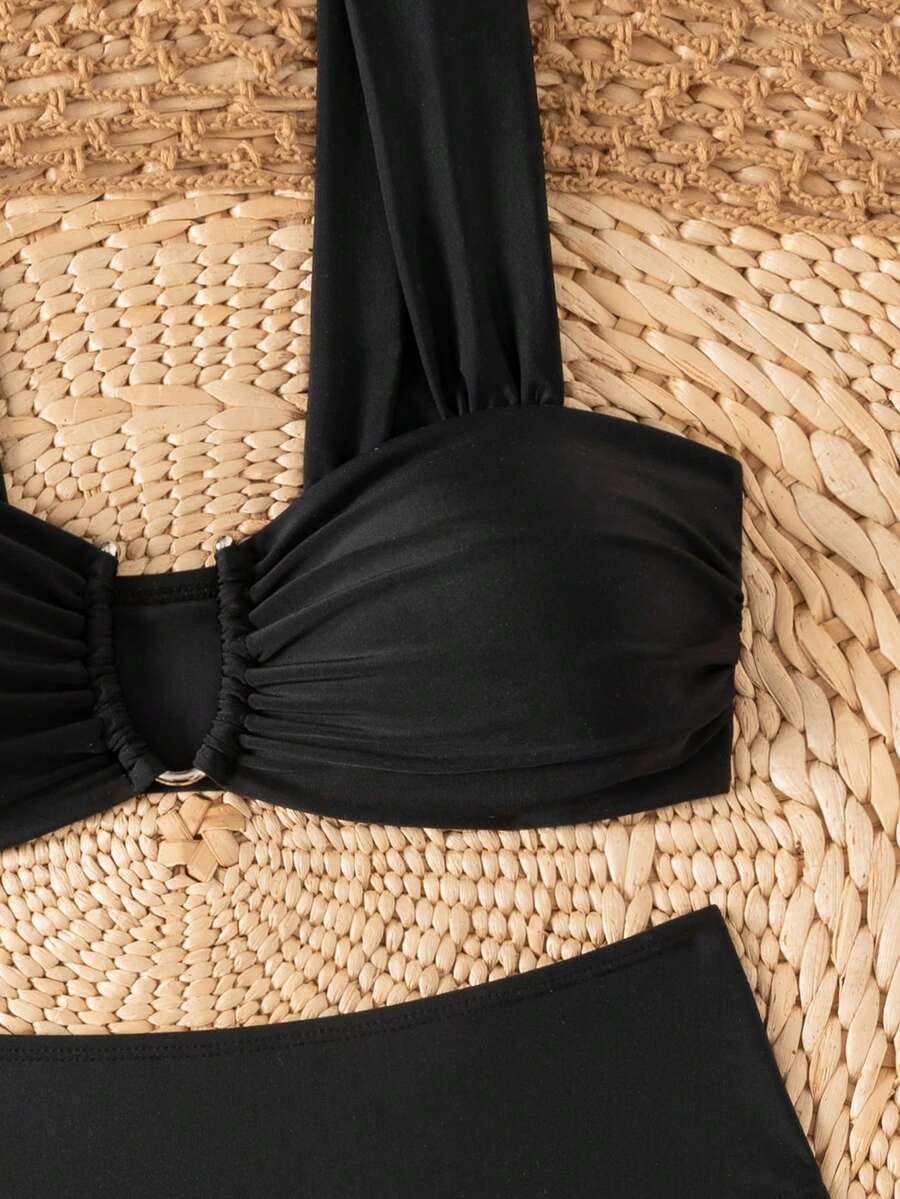 Springbreak black high waist bikini set for women featuring wireless bra top with ruffle lettuce trim and V-wired detail.