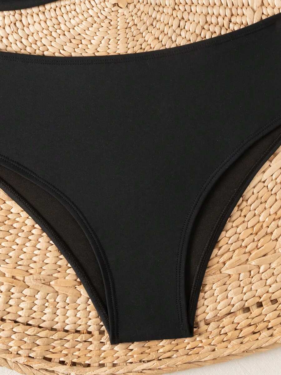 Springbreak black high waist bikini set for women featuring wireless bra top with ruffle lettuce trim and V-wired detail.