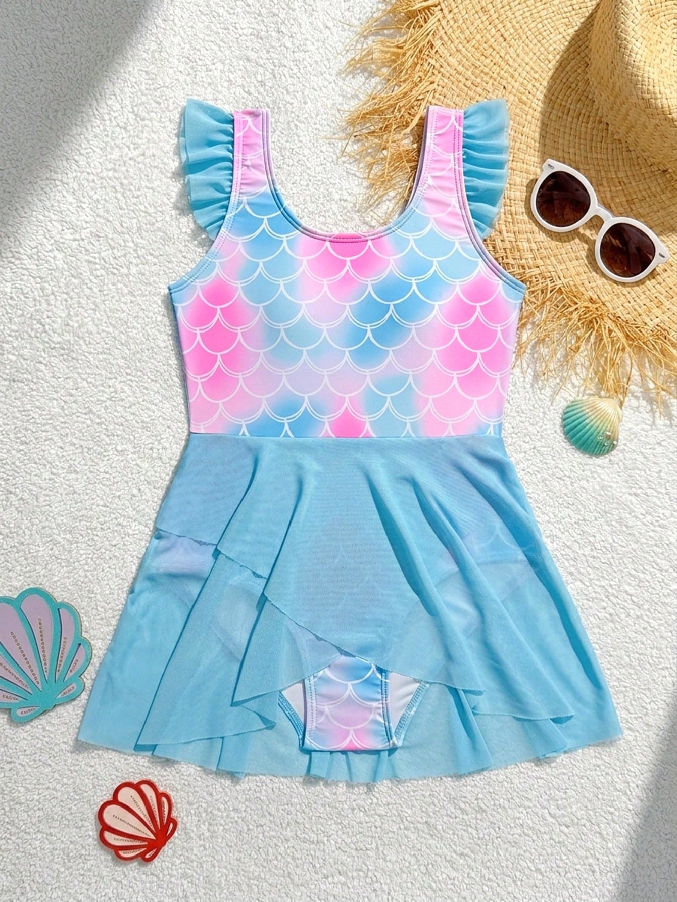 Tween girl one-piece swimsuit with multicolor fish scale graphic print, ruffle details, contrast mesh, round neck, and skirt bottom for beach or pool wear