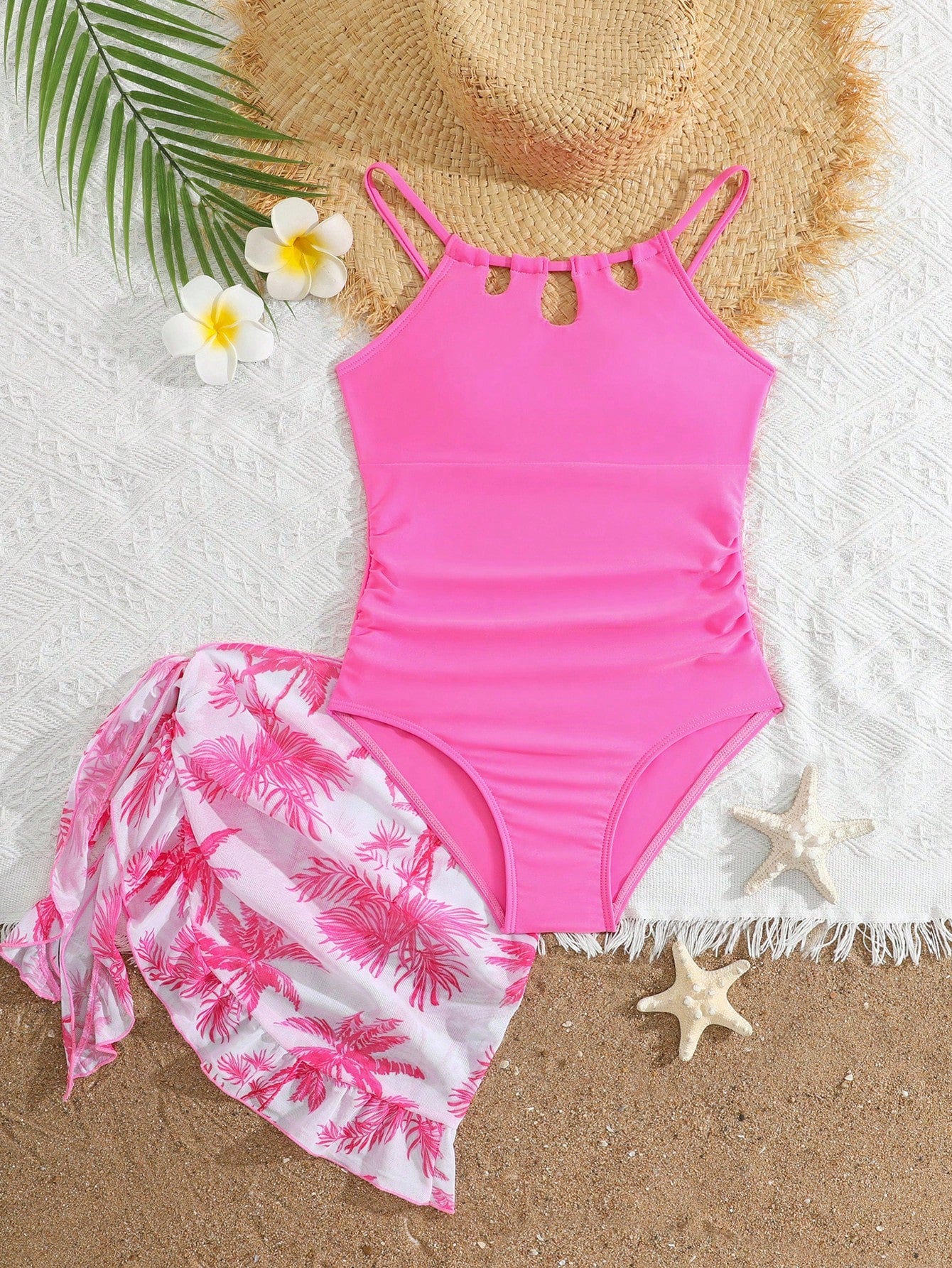 Girls black and white one-piece swimsuit set with cut-out detail, spaghetti straps, sleeveless fitted design, and matching skirt bottom for vacation swimwear.