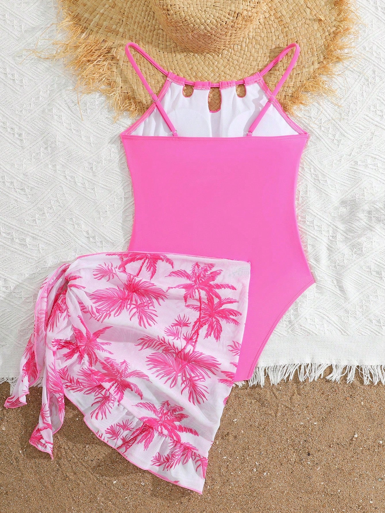 Girls black and white one-piece swimsuit set with cut-out detail, spaghetti straps, sleeveless fitted design, and matching skirt bottom for vacation swimwear.