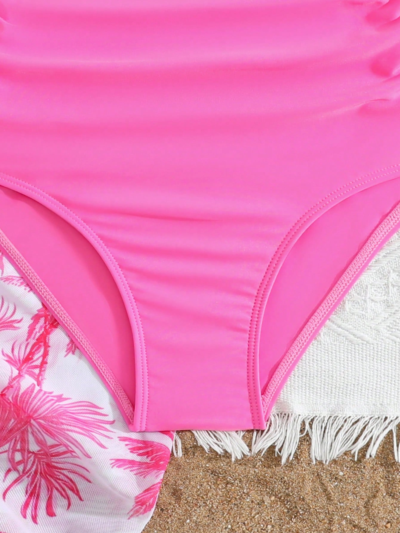Girls black and white one-piece swimsuit set with cut-out detail, spaghetti straps, sleeveless fitted design, and matching skirt bottom for vacation swimwear.