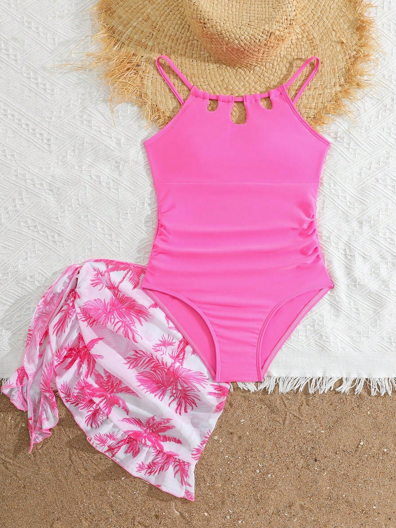 Girls black and white one-piece swimsuit set with cut-out detail, spaghetti straps, sleeveless fitted design, and matching skirt bottom for vacation swimwear.