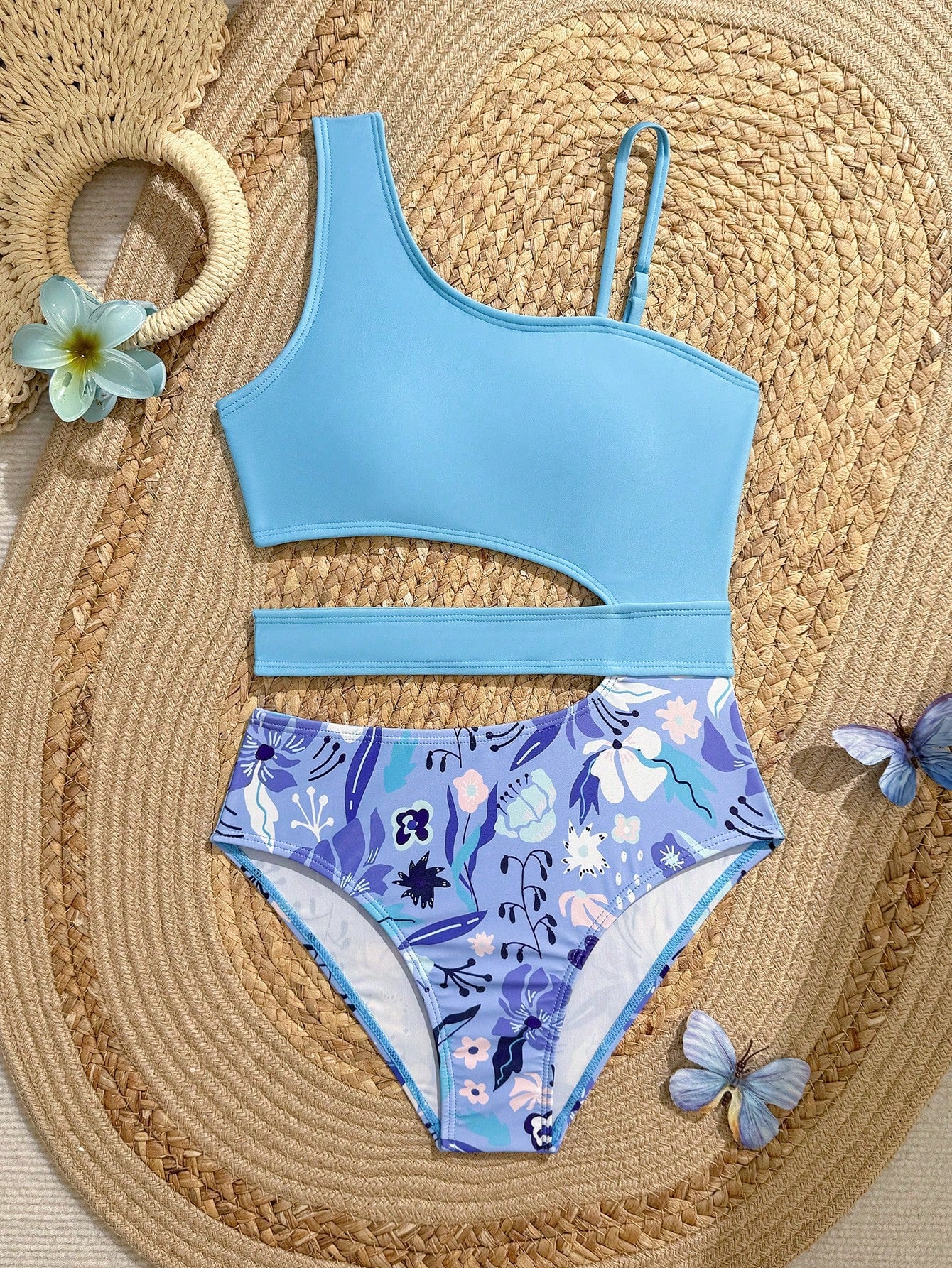 Purple tween girls one-piece swimsuit with asymmetrical neckline, cut-out waist, striped pattern, fitted silhouette, and lined body.