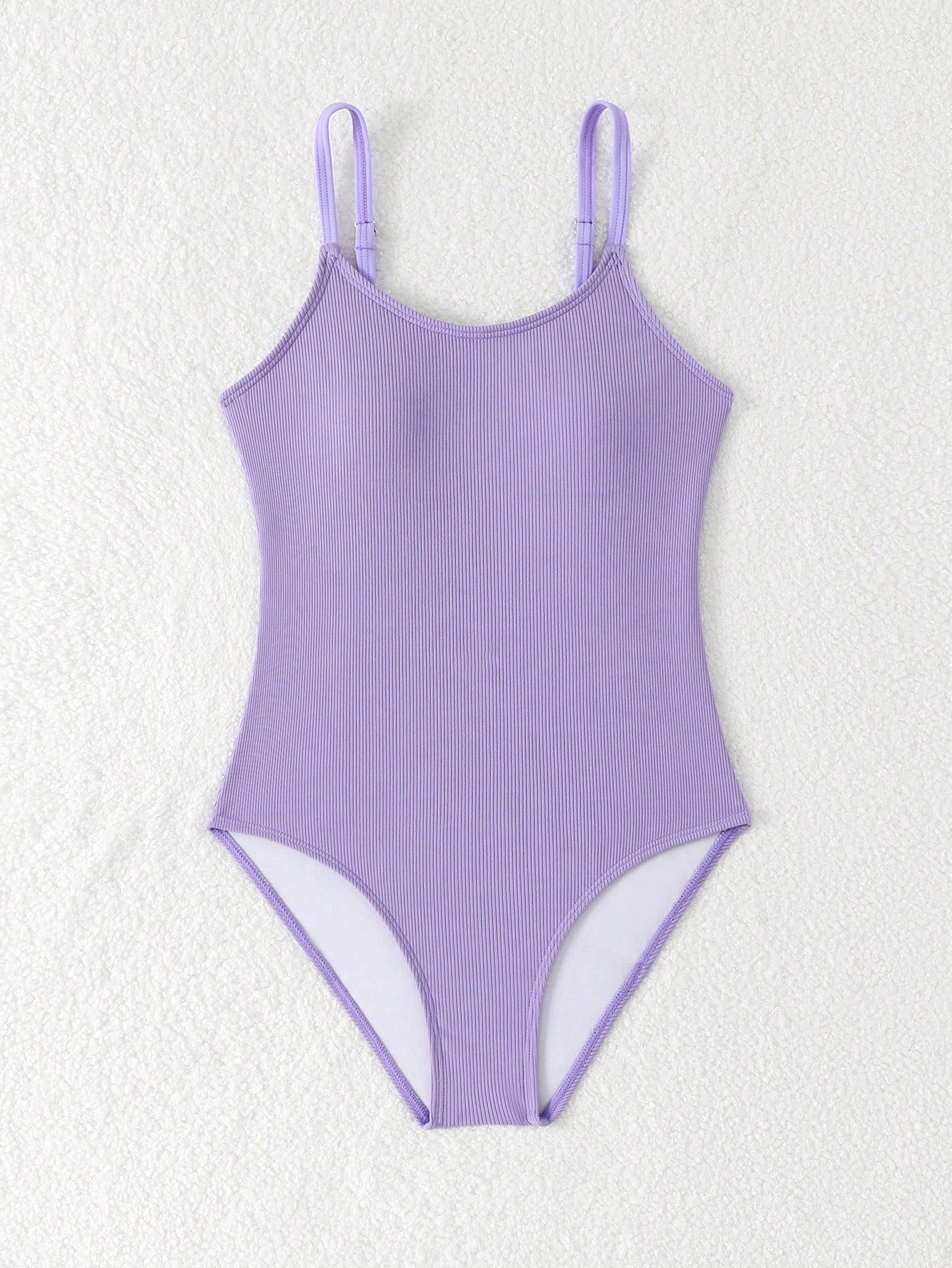 White tween girls one-piece swimsuit with V-neck, cutout detail, appliques, plant pattern, mid-waist bottom, and lined body for beach or swimming