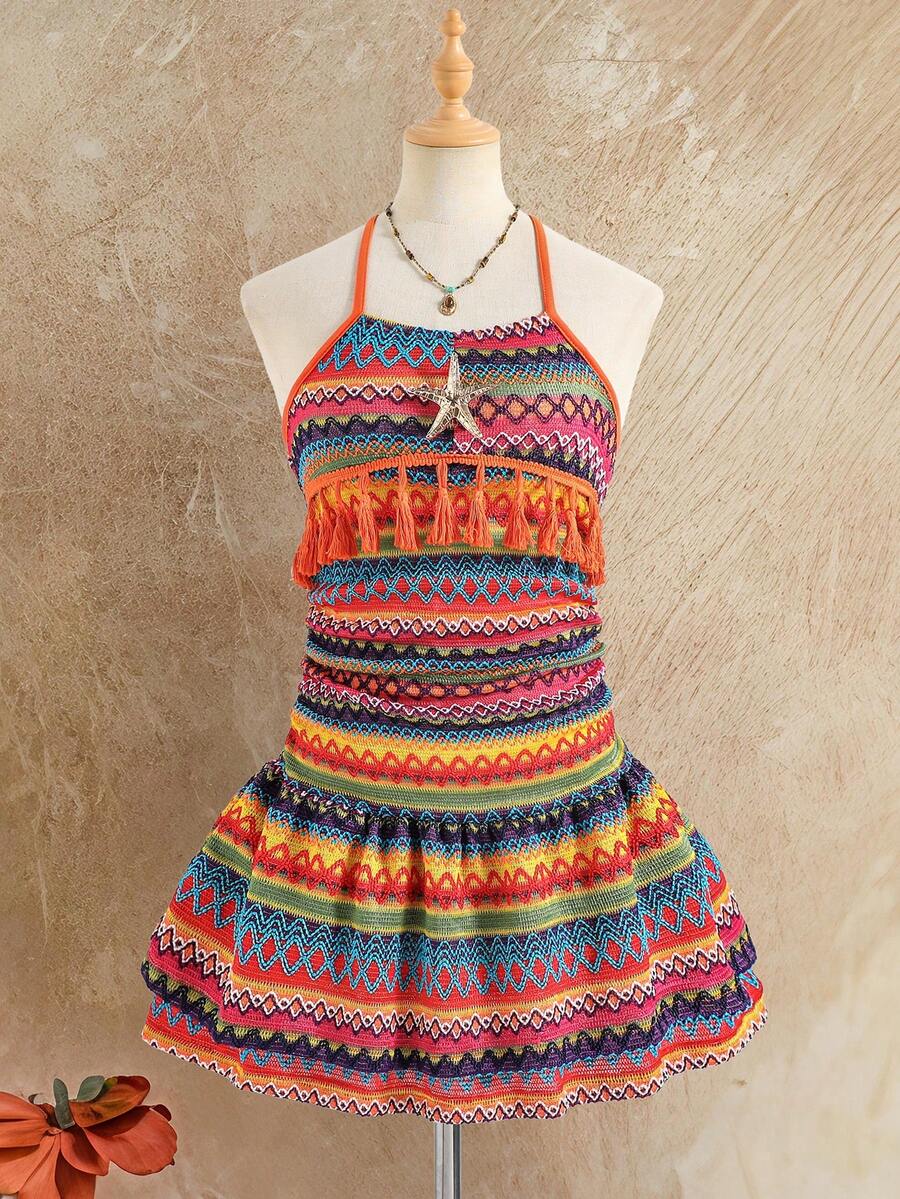 Tween girl black mini dress with halter neckline, backless design, tiered layer detail, high waist, flounce hem, and sleeveless slim fit.
