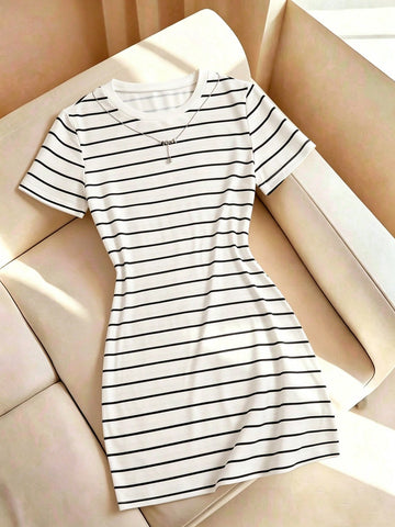 Girls black striped midi dress featuring short sleeves, round neck, slim fit, and flared hem.