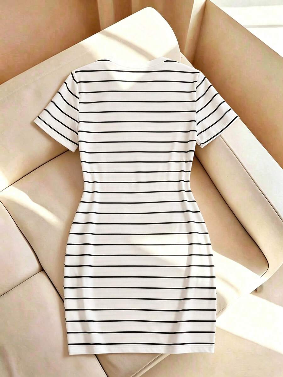 Girls black striped midi dress featuring short sleeves, round neck, slim fit, and flared hem.