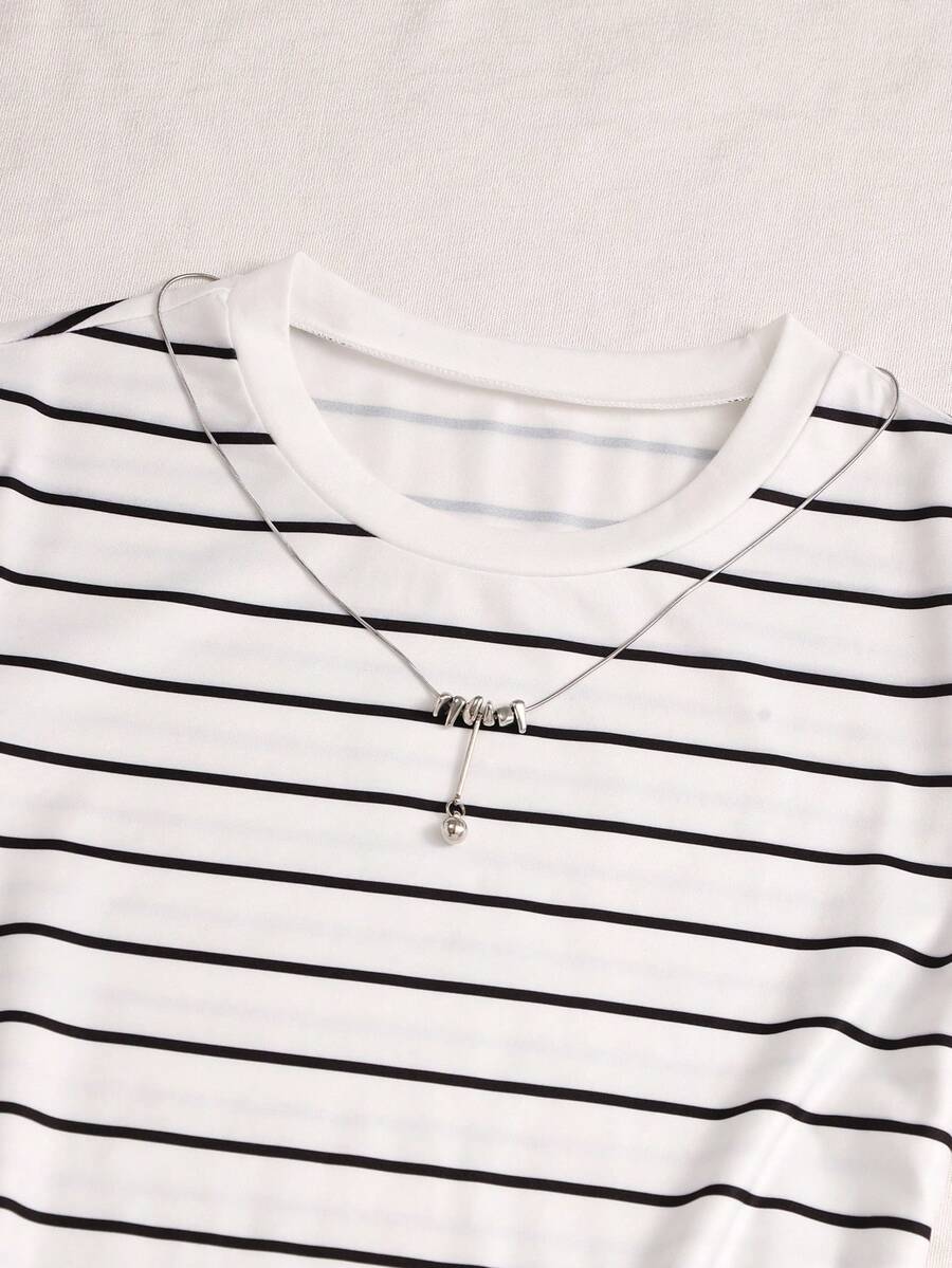 Girls black striped midi dress featuring short sleeves, round neck, slim fit, and flared hem.