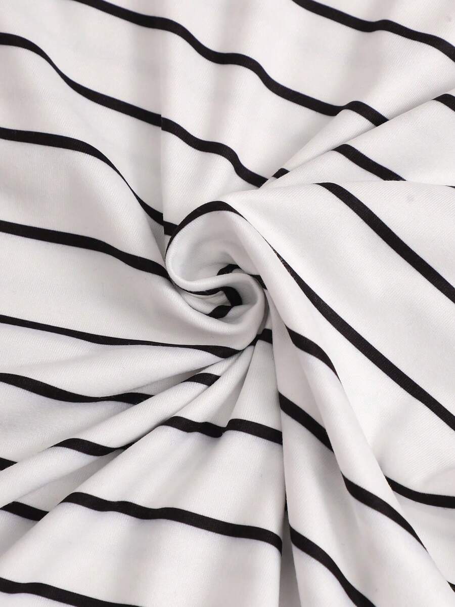 Girls black striped midi dress featuring short sleeves, round neck, slim fit, and flared hem.