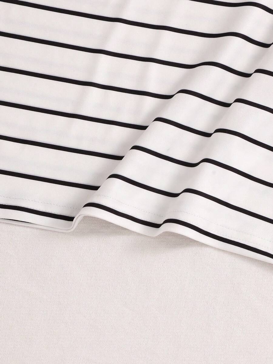 Girls black striped midi dress featuring short sleeves, round neck, slim fit, and flared hem.