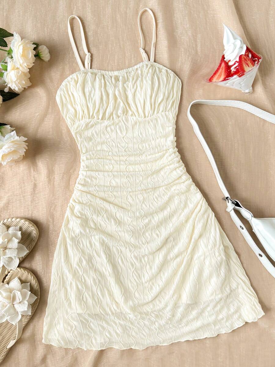 Apricot tween girls sleeveless halter cami dress with appliques, bow front, zipper detail, high waist, flared hem, and short slim fit design.