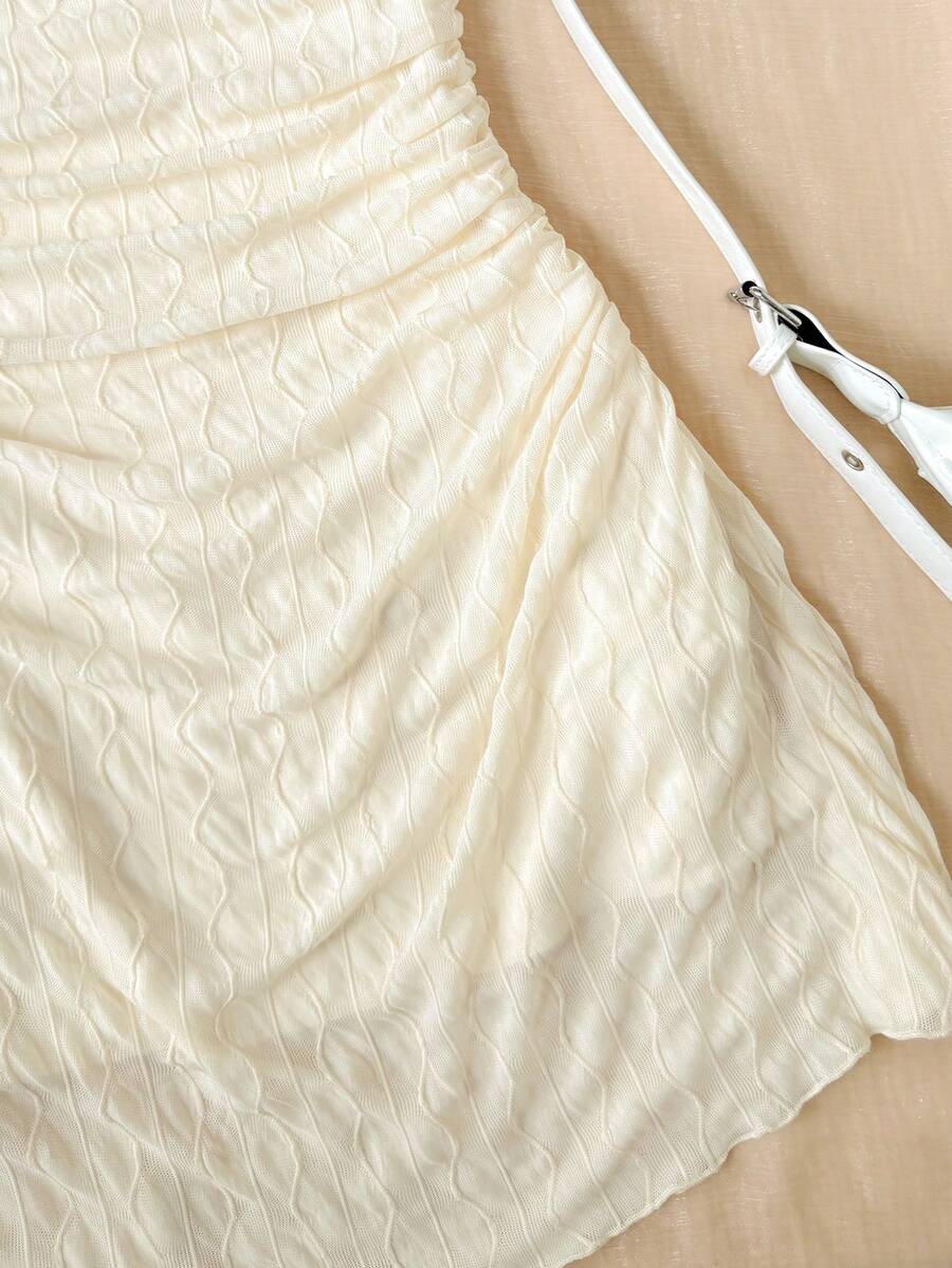 Apricot tween girls sleeveless halter cami dress with appliques, bow front, zipper detail, high waist, flared hem, and short slim fit design.