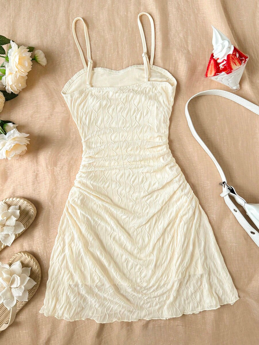 Apricot tween girls sleeveless halter cami dress with appliques, bow front, zipper detail, high waist, flared hem, and short slim fit design.
