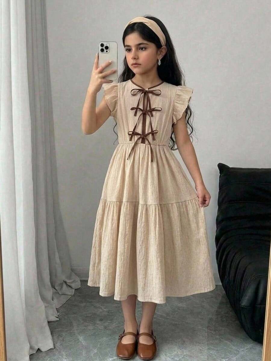 Apricot striped tween girl midi dress with flounce short sleeves, round neckline, high-waist belt, and layered ruffle hem.