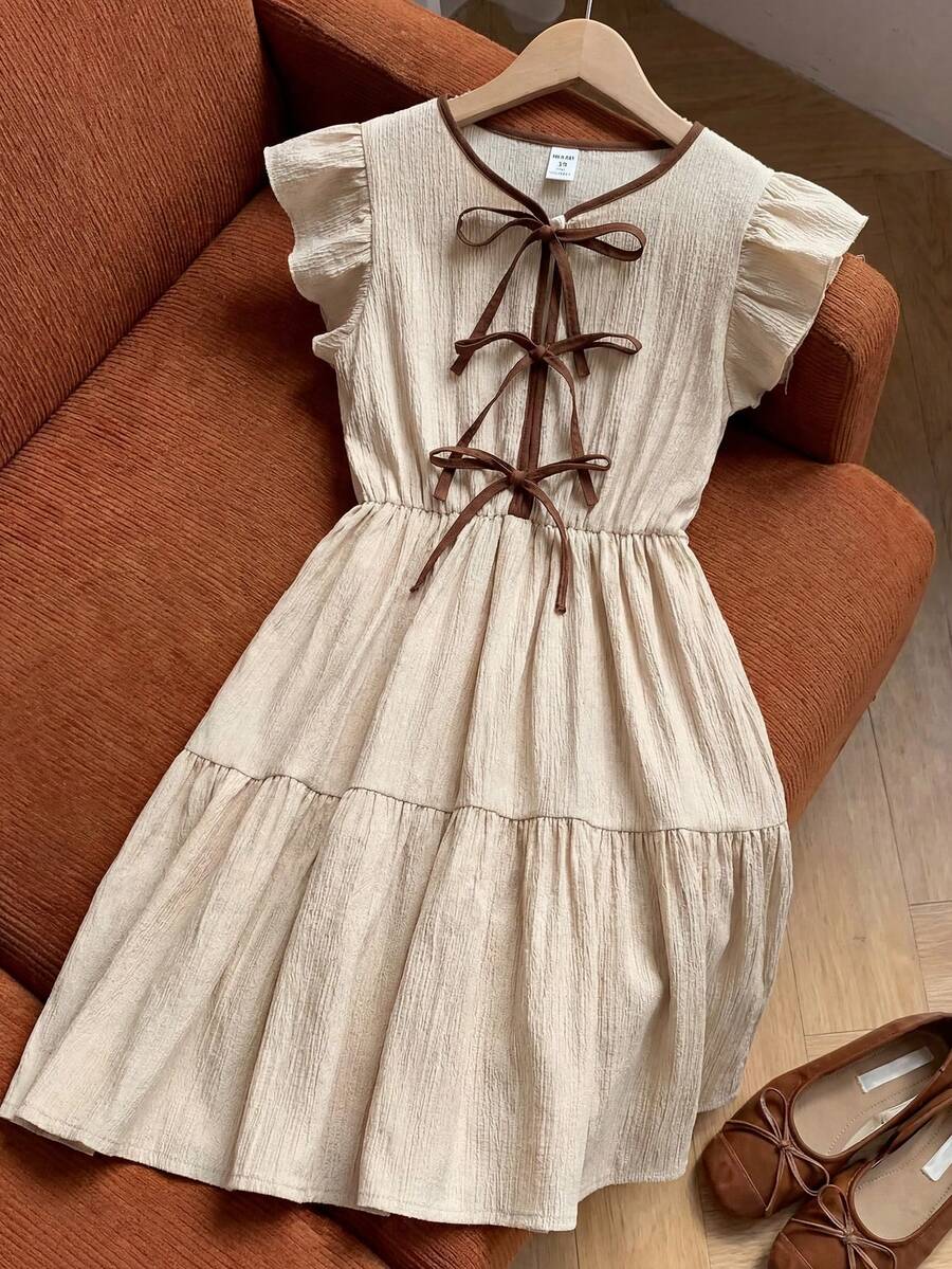 Apricot striped tween girl midi dress with flounce short sleeves, round neckline, high-waist belt, and layered ruffle hem.