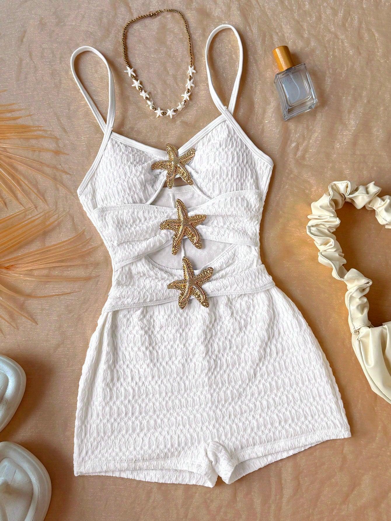 Apricot one-piece swimsuit for tween girls with a halter neckline, ruffle trim, textured knit fabric, fitted shape, and starfish metal decor.