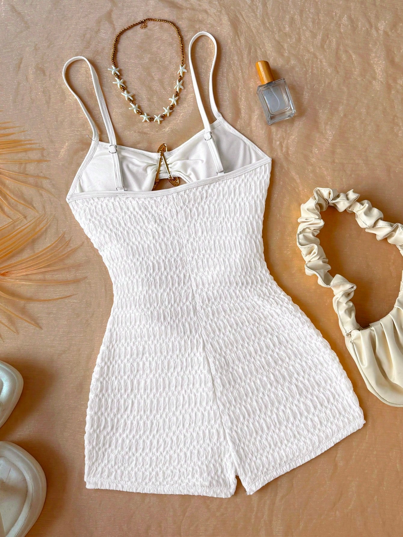Apricot one-piece swimsuit for tween girls with a halter neckline, ruffle trim, textured knit fabric, fitted shape, and starfish metal decor.