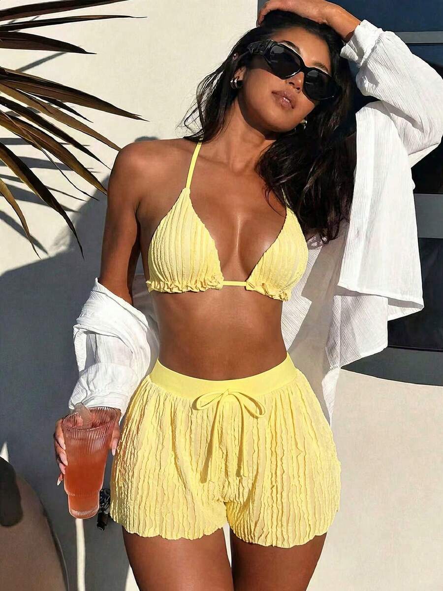 Women's 3-piece frill trim bikini set with halter tie-back top and high waist bottoms.