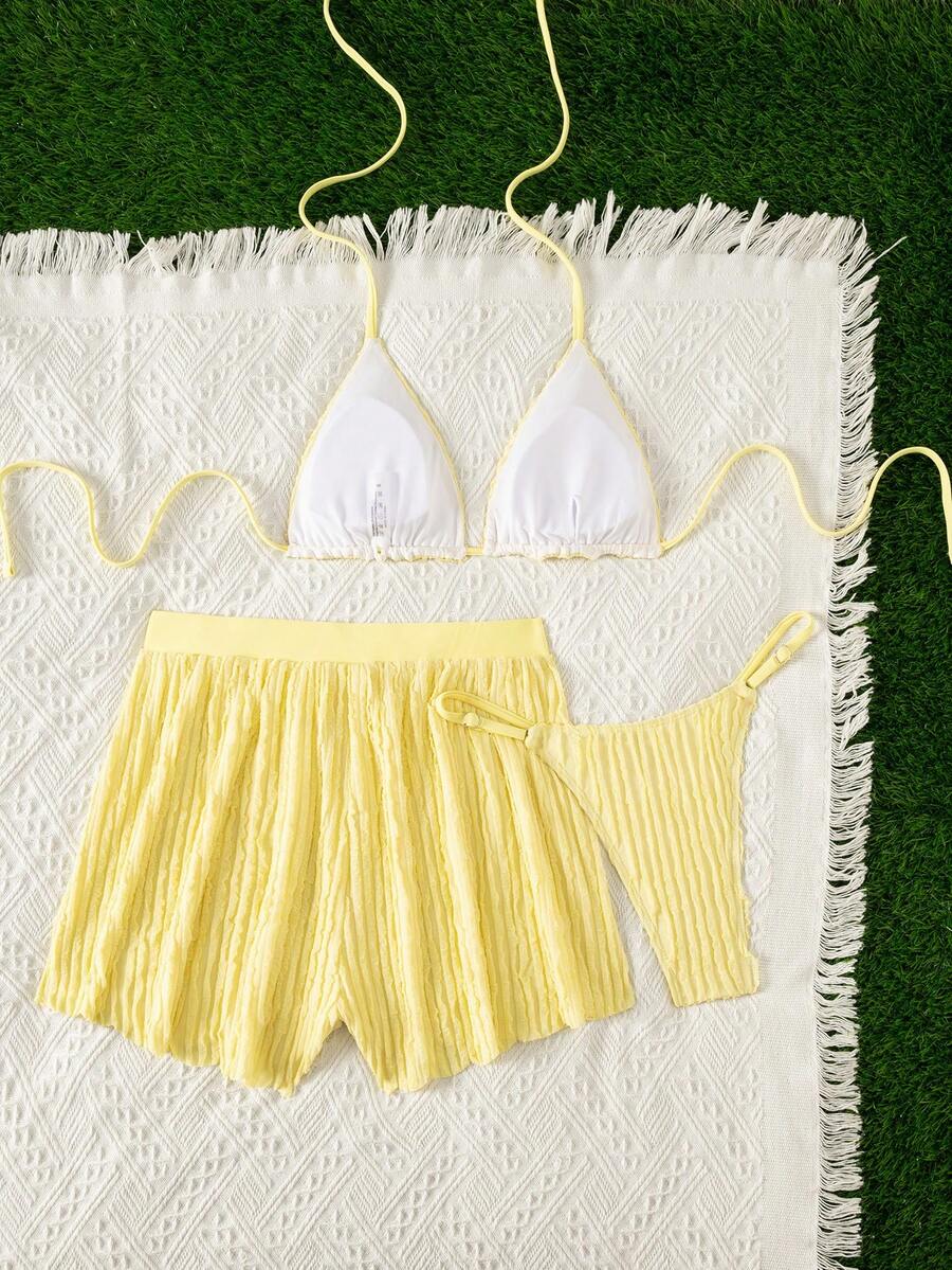 Women's 3-piece frill trim bikini set with halter tie-back top and high waist bottoms.