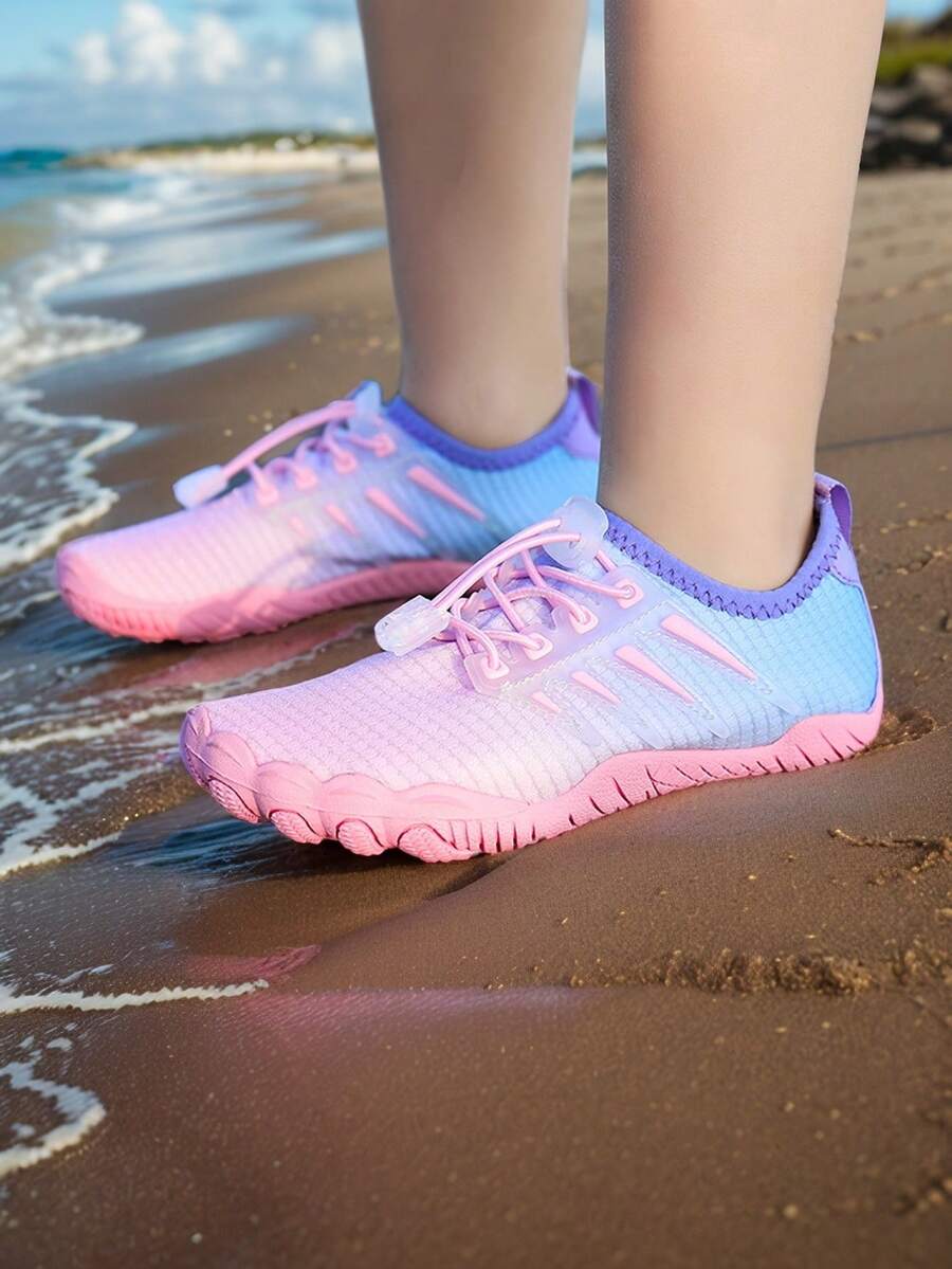 Baby pink girls' water shoes with lace-up design and non-slip rubber outsole for beach and outdoor sports.