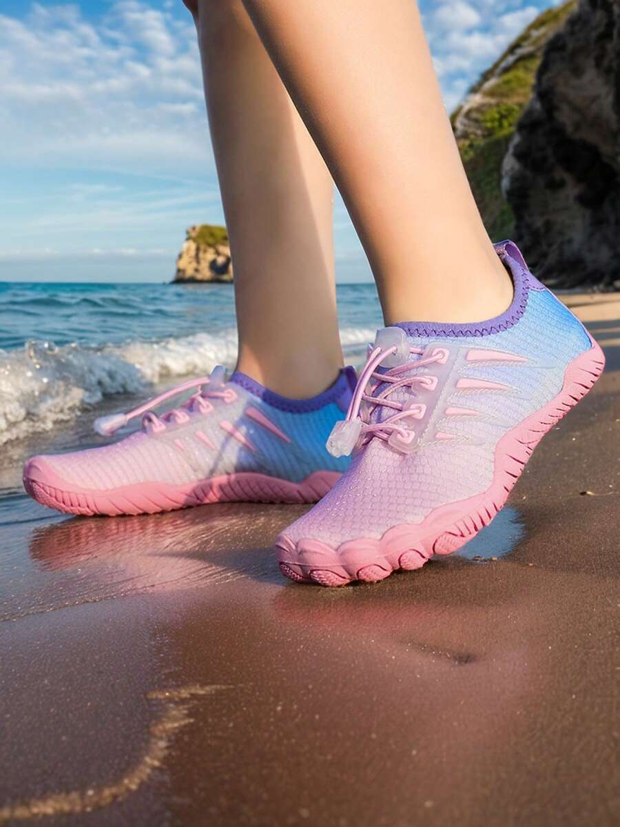 Baby pink girls' water shoes with lace-up design and non-slip rubber outsole for beach and outdoor sports.