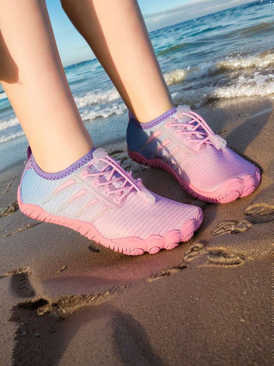 Baby pink girls' water shoes with lace-up design and non-slip rubber outsole for beach and outdoor sports.