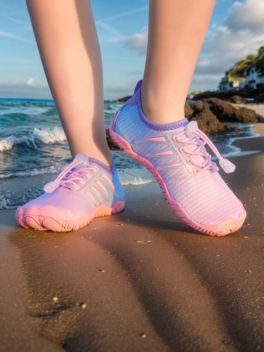 Baby pink girls' water shoes with lace-up design and non-slip rubber outsole for beach and outdoor sports.
