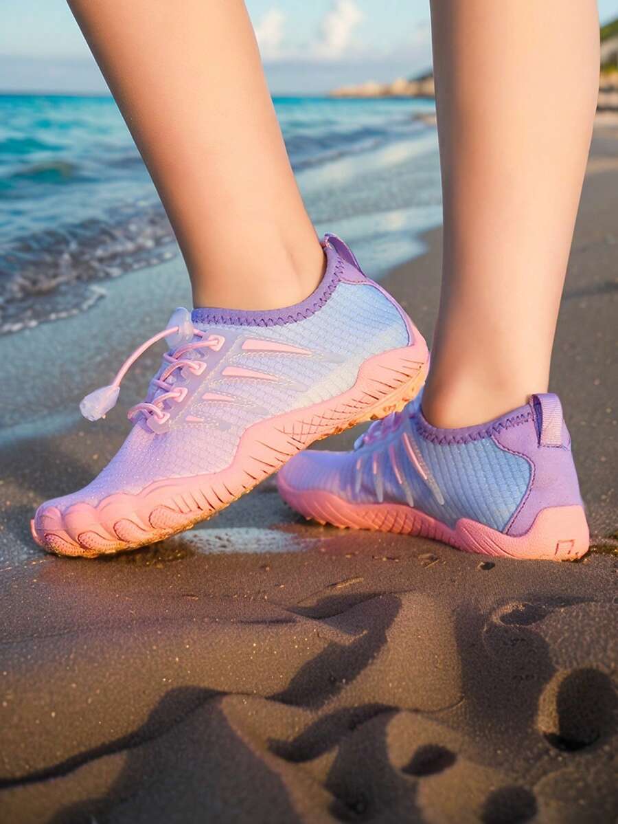 Baby pink girls' water shoes with lace-up design and non-slip rubber outsole for beach and outdoor sports.