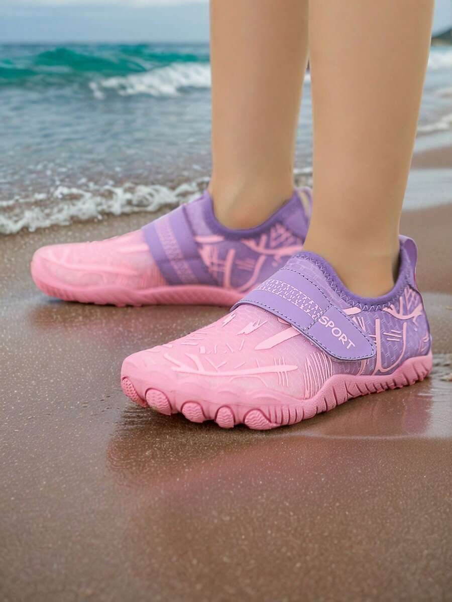 Baby pink girls' water shoes featuring breathable mesh uppers, hook-and-loop strap closure, and non-slip rubber soles.