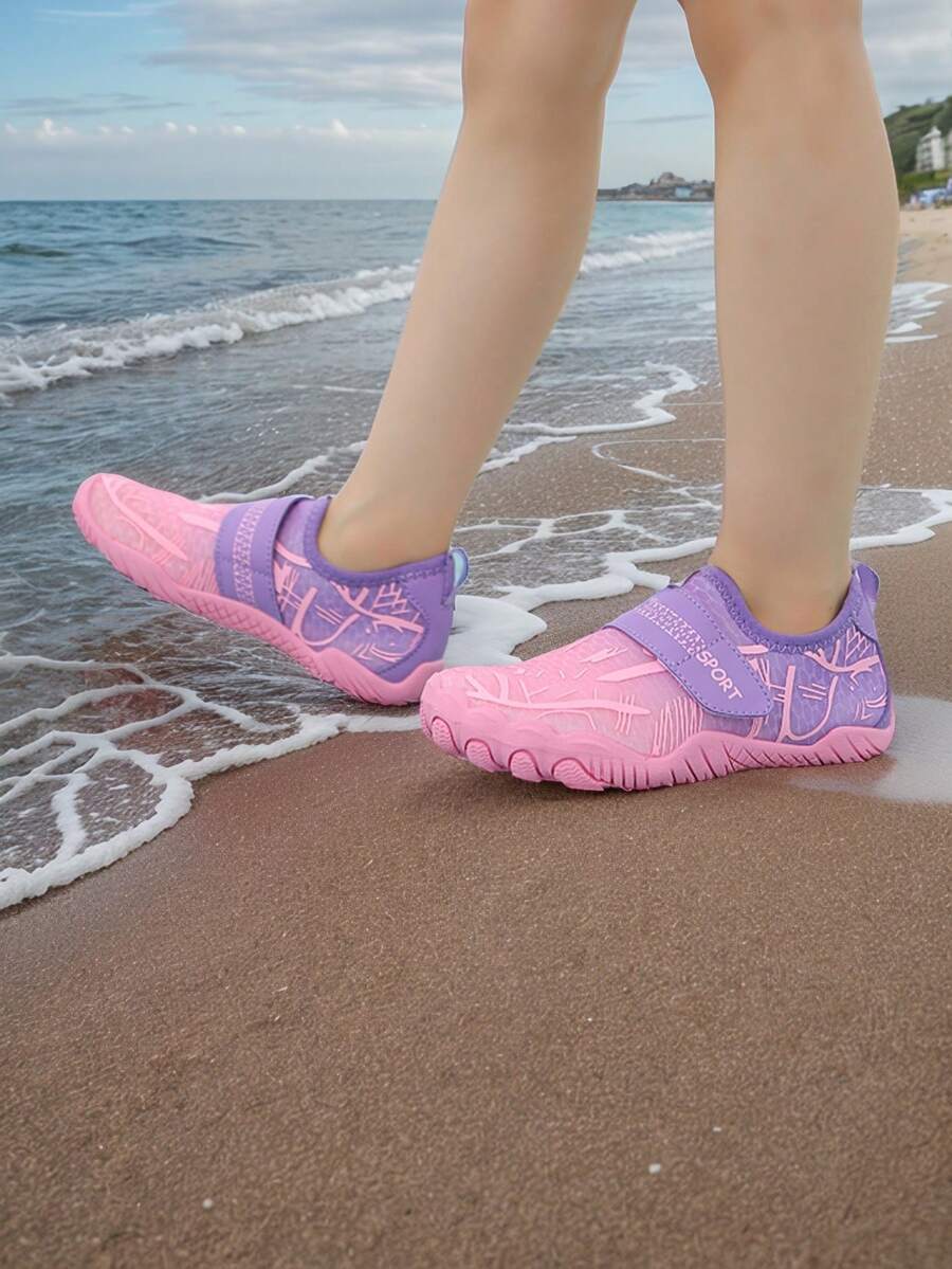 Baby pink girls' water shoes featuring breathable mesh uppers, hook-and-loop strap closure, and non-slip rubber soles.
