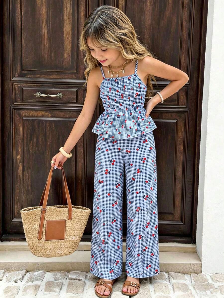 Girls 2-piece summer outfit set featuring a blue bow print camisole top with spaghetti straps and matching high-waisted straight leg pants.