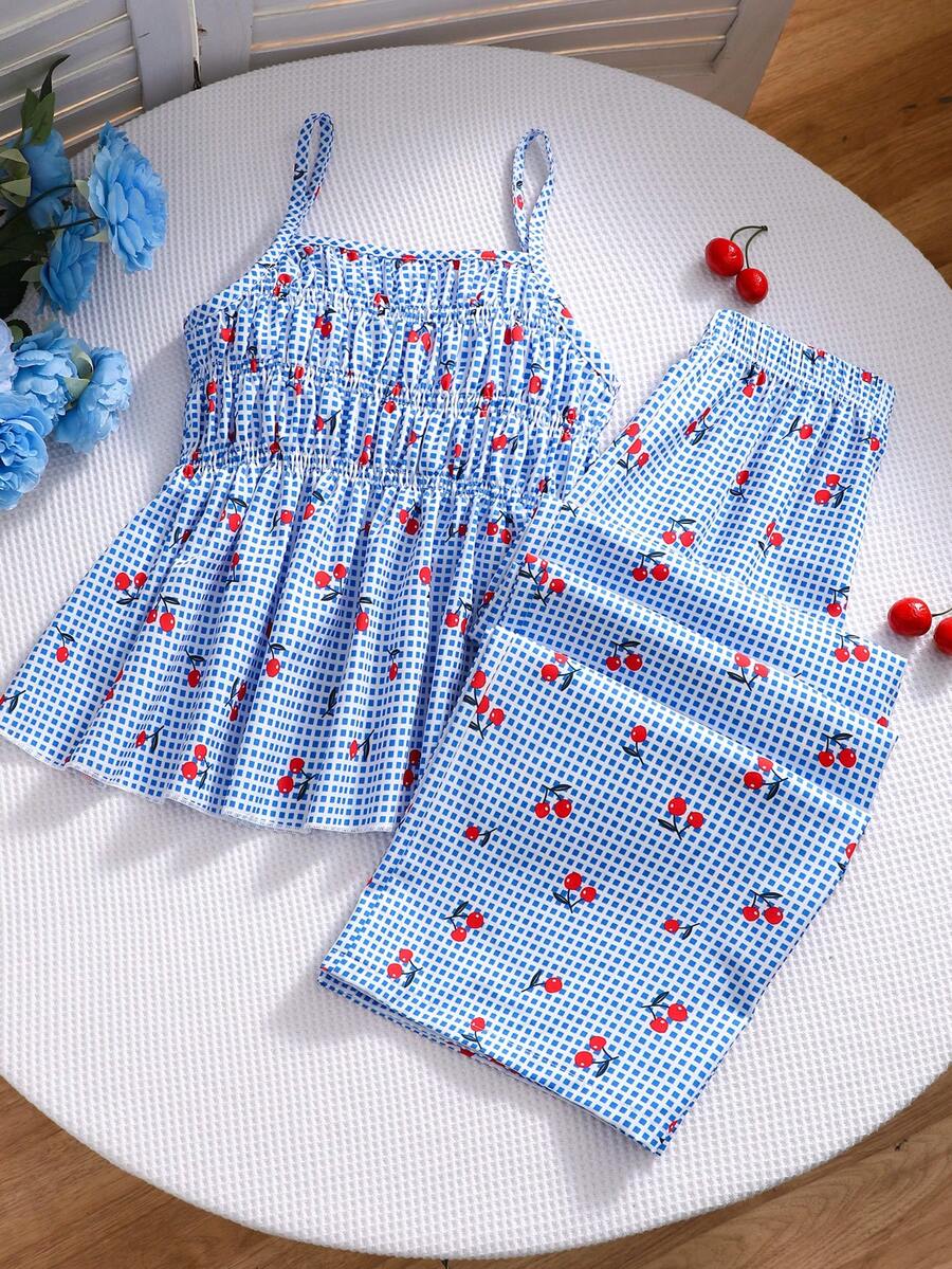 Girls 2-piece summer outfit set featuring a blue bow print camisole top with spaghetti straps and matching high-waisted straight leg pants.