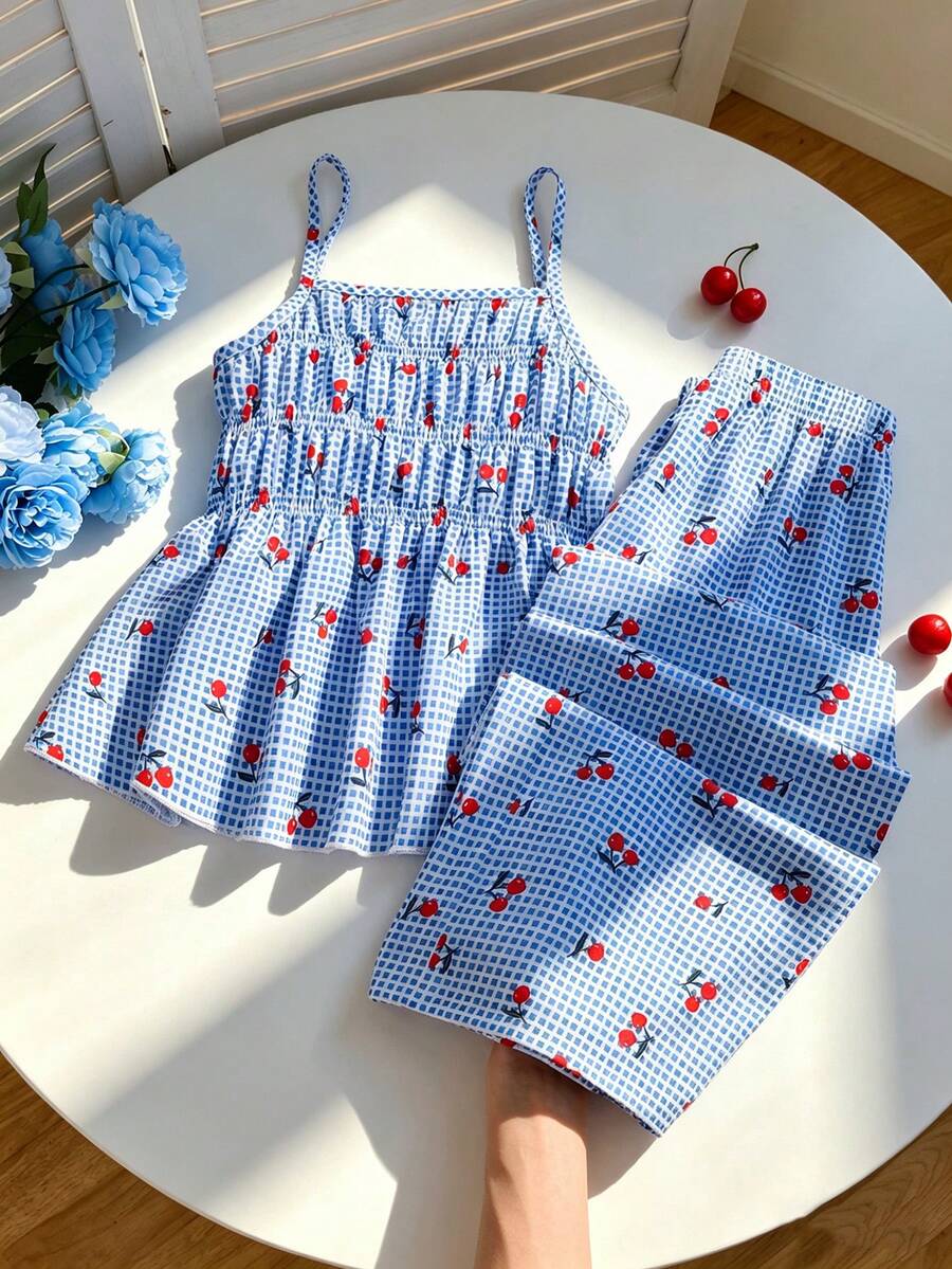 Girls 2-piece summer outfit set featuring a blue bow print camisole top with spaghetti straps and matching high-waisted straight leg pants.