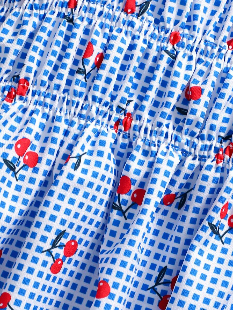 Girls 2-piece summer outfit set featuring a blue bow print camisole top with spaghetti straps and matching high-waisted straight leg pants.