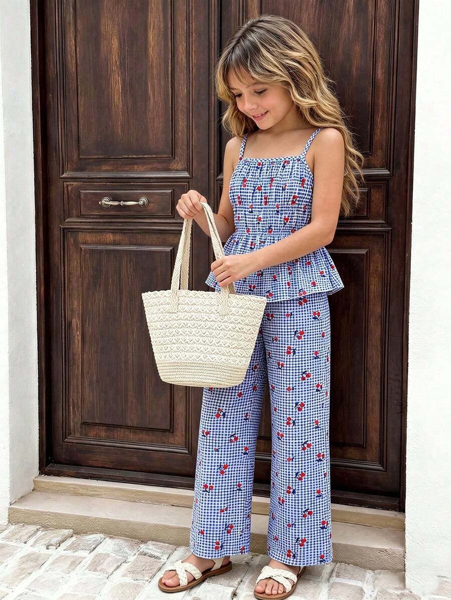 Girls 2-piece summer outfit set featuring a blue bow print camisole top with spaghetti straps and matching high-waisted straight leg pants.