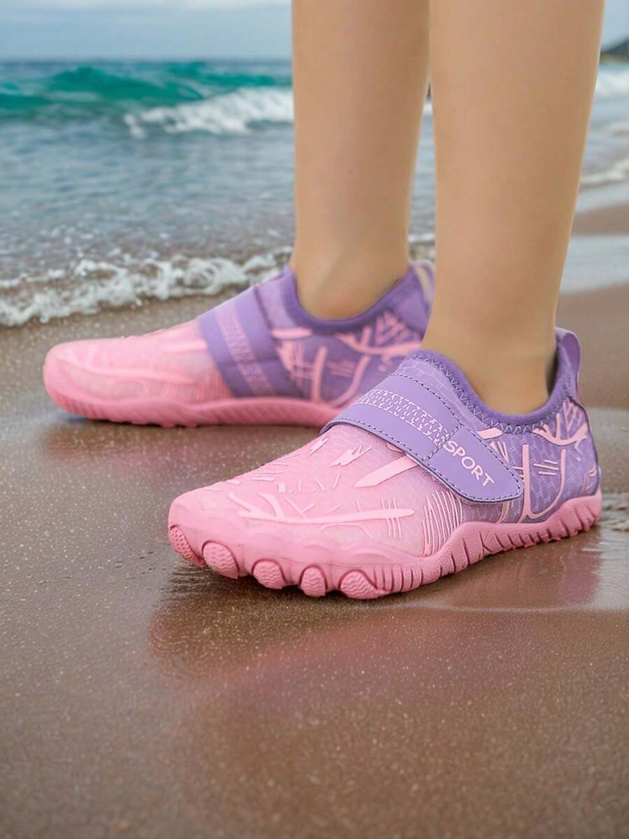 Baby pink girls' water shoes featuring breathable mesh uppers, hook-and-loop strap closure, and non-slip rubber soles.