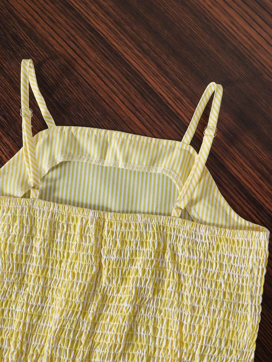 Tween girls casual 2-piece set featuring an apricot woven camisole crop top with back shirring and matching high-waisted loose long pants.