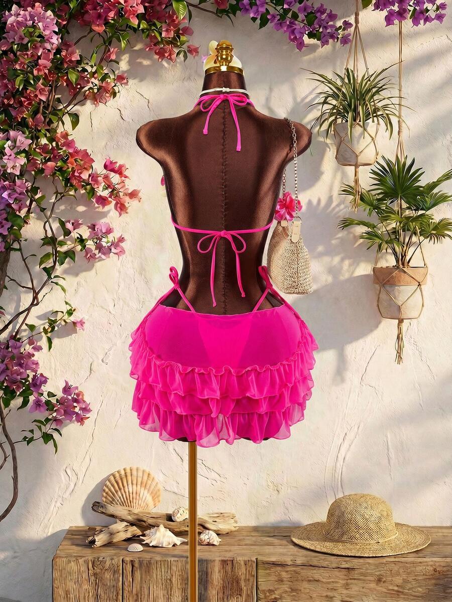 Women's 3-piece blue bikini swimwear set featuring a crop top with 3D rose accents, tie back detail, spaghetti straps, and tie-side bottoms.