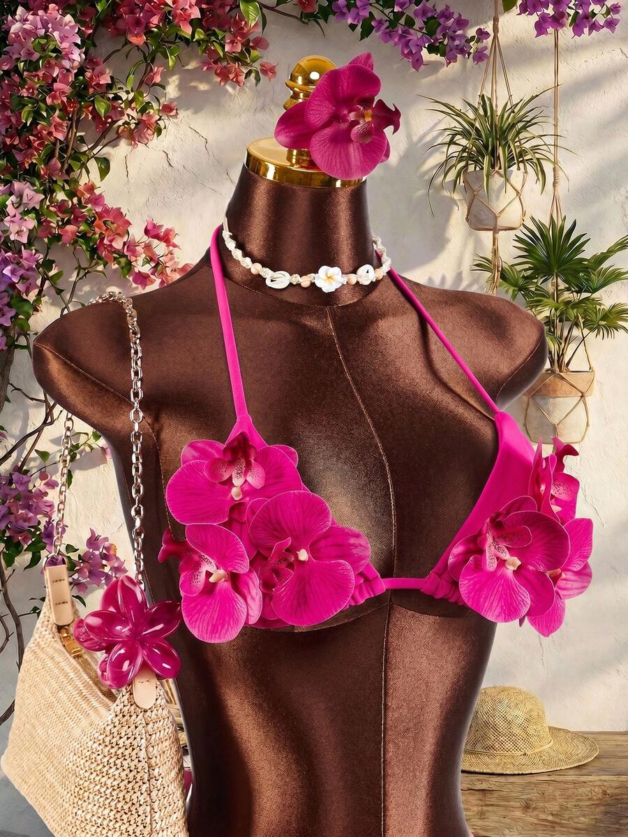 Women's 3-piece blue bikini swimwear set featuring a crop top with 3D rose accents, tie back detail, spaghetti straps, and tie-side bottoms.