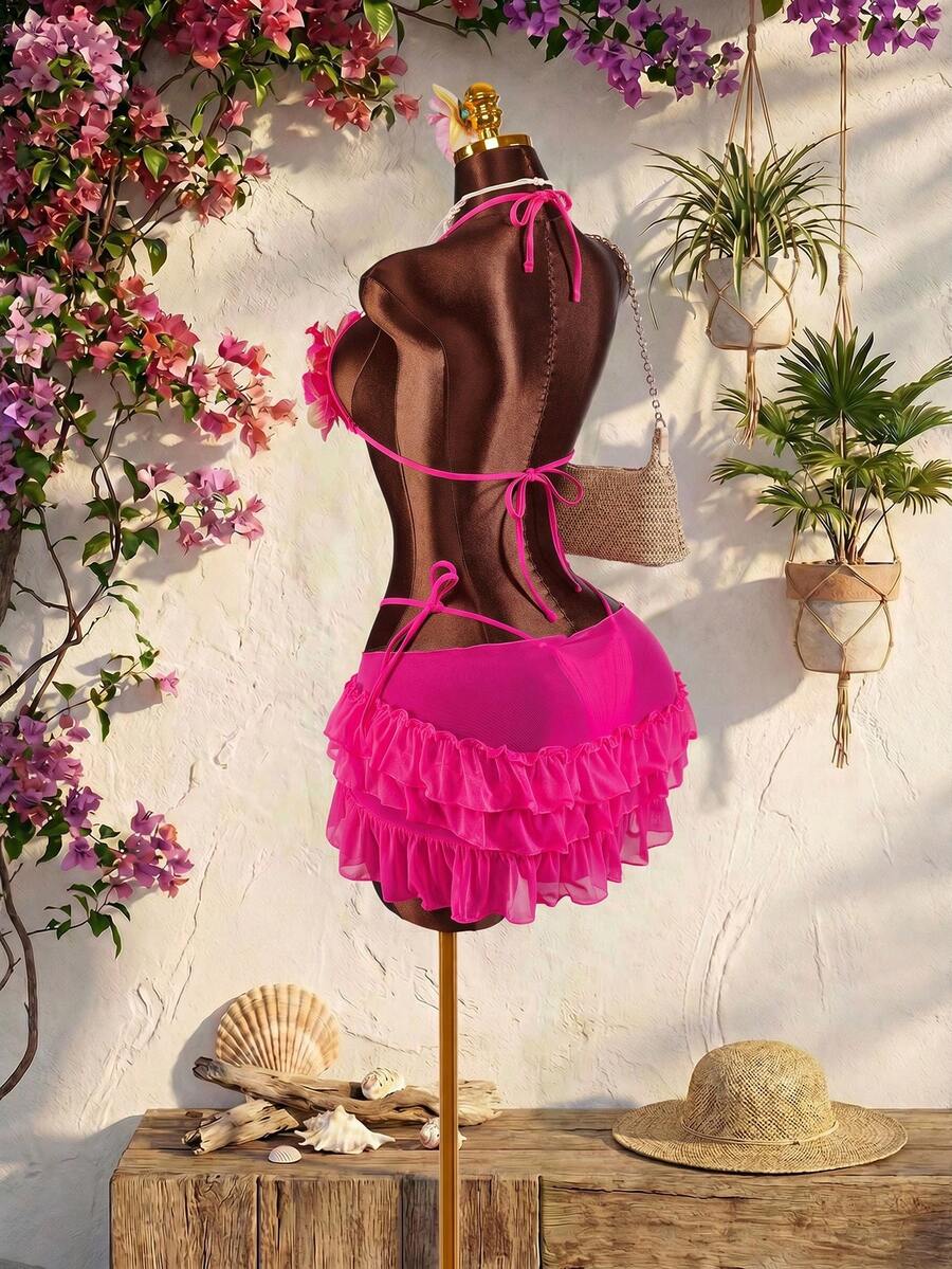 Women's 3-piece blue bikini swimwear set featuring a crop top with 3D rose accents, tie back detail, spaghetti straps, and tie-side bottoms.