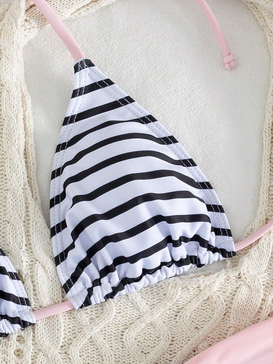 Women's striped halter two-piece swimsuit featuring a lace-up triangle top with removable padding and high-cut low-waist bikini bottoms.