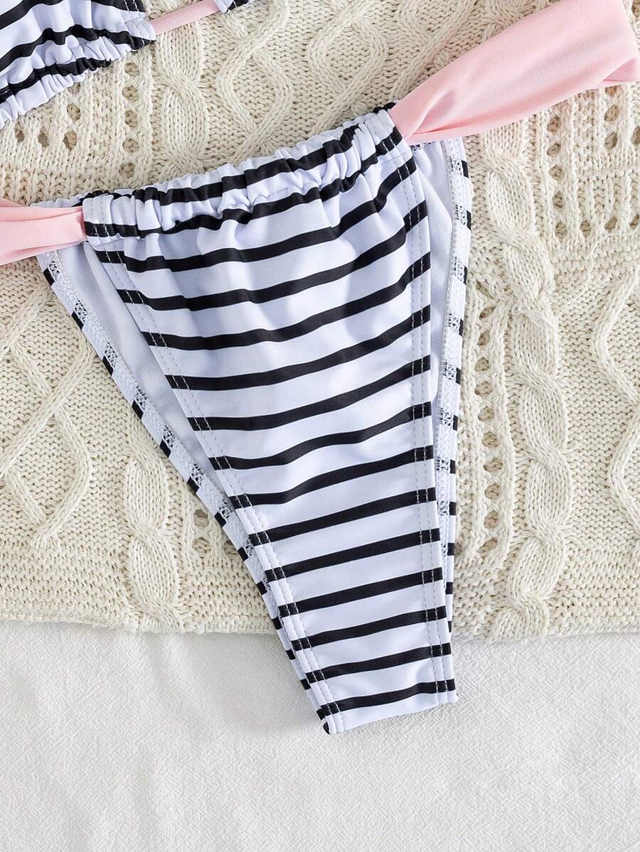 Women's striped halter two-piece swimsuit featuring a lace-up triangle top with removable padding and high-cut low-waist bikini bottoms.