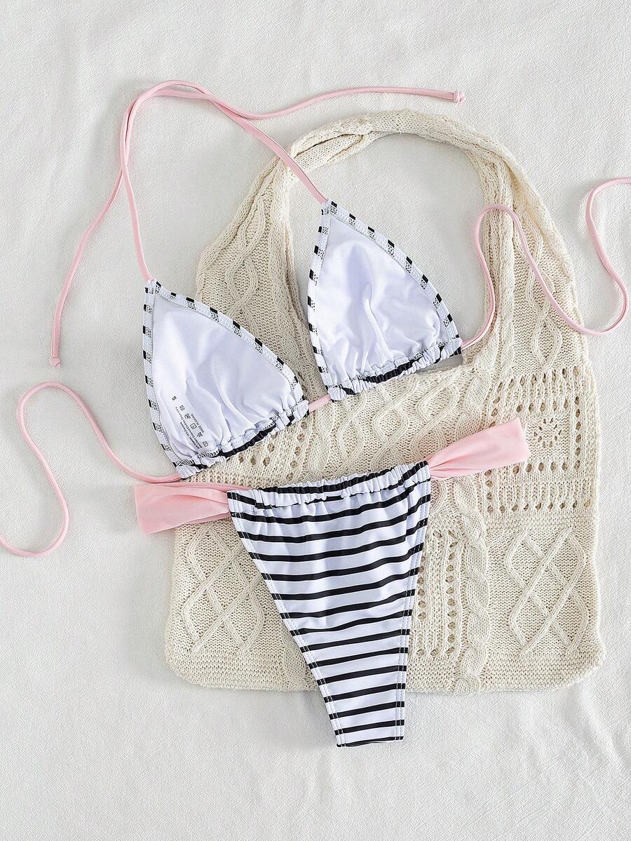 Women's striped halter two-piece swimsuit featuring a lace-up triangle top with removable padding and high-cut low-waist bikini bottoms.