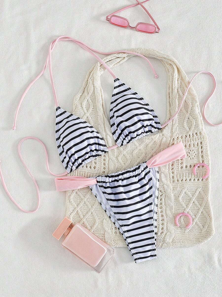 Women's striped halter two-piece swimsuit featuring a lace-up triangle top with removable padding and high-cut low-waist bikini bottoms.
