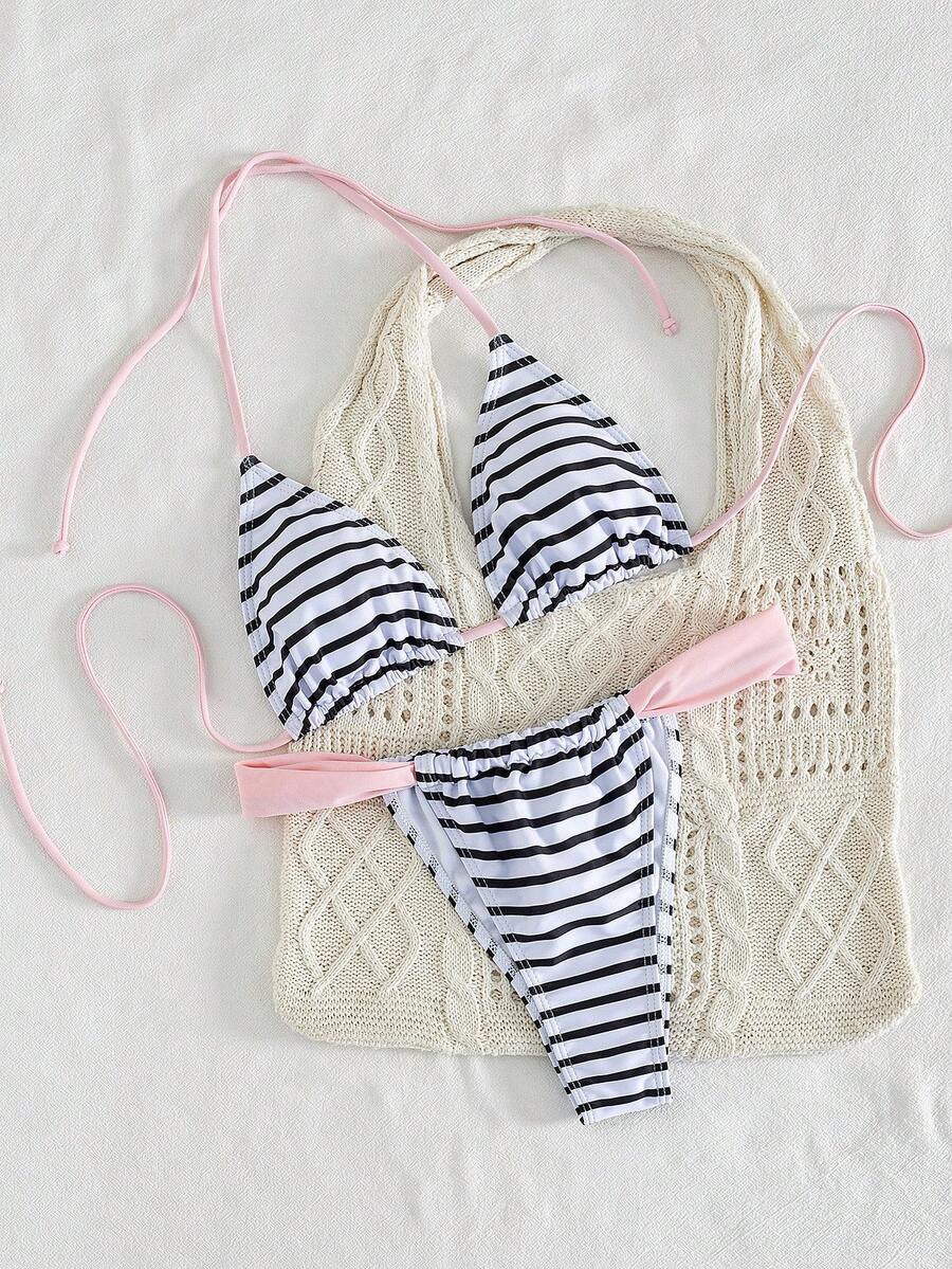 Women's striped halter two-piece swimsuit featuring a lace-up triangle top with removable padding and high-cut low-waist bikini bottoms.